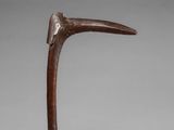 an image of a wooden sculpture of a bird with a long beak
