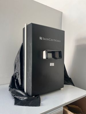 a black box sitting on top of a white desk
