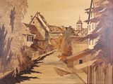 une photo d'un tableau représentant une rue d'un village