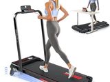 a woman running on a treadmill with a laptop on top of it
