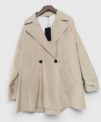 a close up of a coat on a hanger on a wall