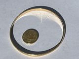a coin in the middle of a ring on a table