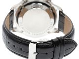 the watch is black with a white face and a silver bezel