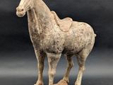 statue of a horse with a saddle on it ' s back