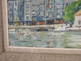a picture of a painting of a city by the water