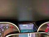 a close up of a car dashboard with a speedometer