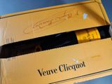 a box with a bottle of wine inside of it