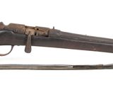 an old gun with a wooden handle on a white background
