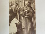 an old picture of a woman and a dog