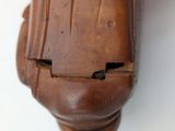 a close up of a wooden object with a hole in it