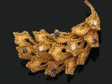 an image of a gold and diamond broochle