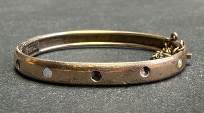 a close up of a bracelet on a table