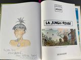 an open book with a drawing of a man on it