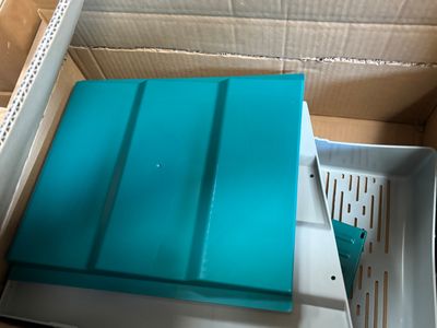 a box that has a blue tray inside of it