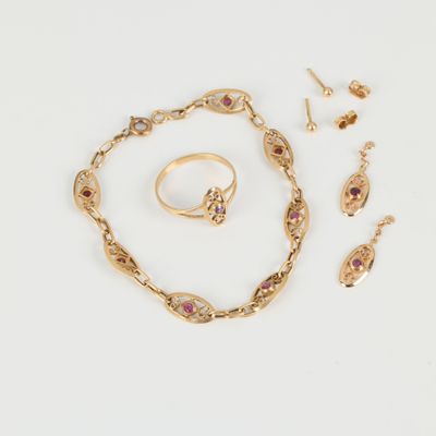 a collection of gold jewellery including a bracelet, ring, and earrings