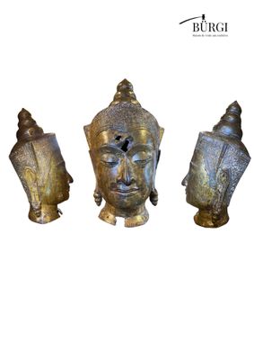 three statues of buddhas are shown on a white background