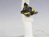 a lamp that has a bird on top of it