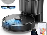 une photo d'un aspirateur robot à côté d'un smartphone