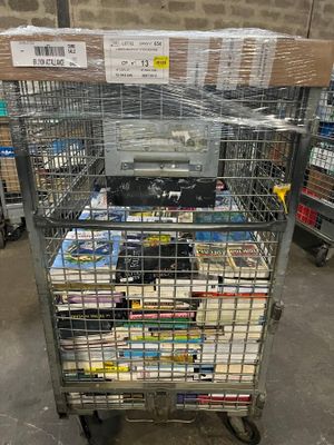 a metal cart with a lot of books in it
