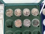 a box of coins that are sitting on a table