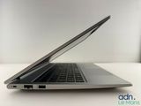 a laptop computer sitting on a table with a white background