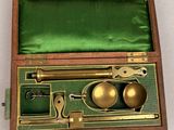 brass plated microscope set in wooden case with green velvet lining