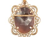 an image of a picture of a woman is shown in a pendant
