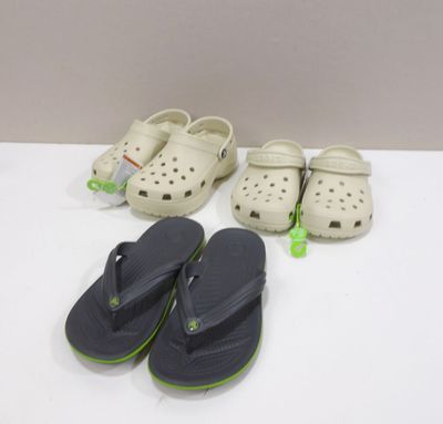 two pairs of crocs sandals and a pair of flip flop flop flop flop flop flop flop flop flop
