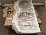 a toilet that is wrapped in plastic and sitting on a pallet