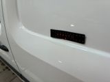 a close up of a white truck with a sticker on it ' s side
