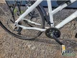 a close up view of a bicycle with a chain attached to the front wheel