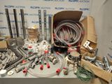 many different types of hoses and fittings on a table