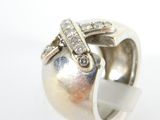 an image of a silver ring with diamonds on a white background