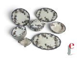 a lot of plates and bowls that are sitting together