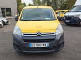 yellow citrole van parked in a parking lot next to other vehicles
