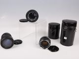 four different types of camera lenses on a white surface
