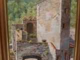 an oil painting of an old building in a frame on a wall