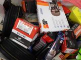 a pile of assorted items in a bin on the floor
