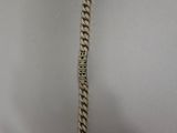 a close up of a metal chain with a chain attached to it