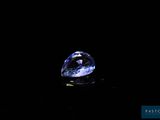 a blue diamond on a black background