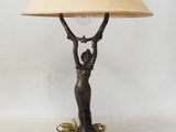a lamp that is sitting on a table with a lamp shade on it