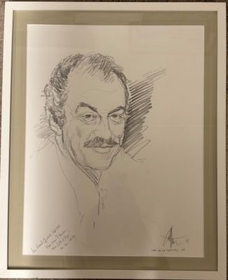 portrait d'un homme portant une moustache et une barbiche, dans un cadre argenté