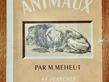 un vieux livre sur lequel est représenté un chien couché sur le flanc