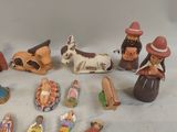 many figurines of people and animals on the table