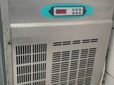 an image of a stainless steel freezer sitting on top of a tiled floor