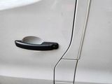 a close up of a door handle on a white car