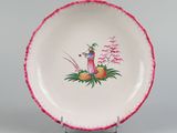 a plate with a picture of a woman and a dog on it
