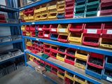 many bins of assorted items on the shelves