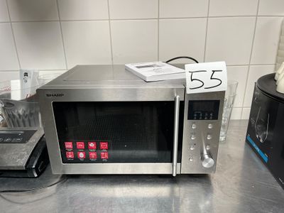a microwave that is sitting on a counter in a kitchen