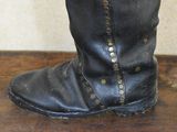 a close up of a pair of black boots on a table